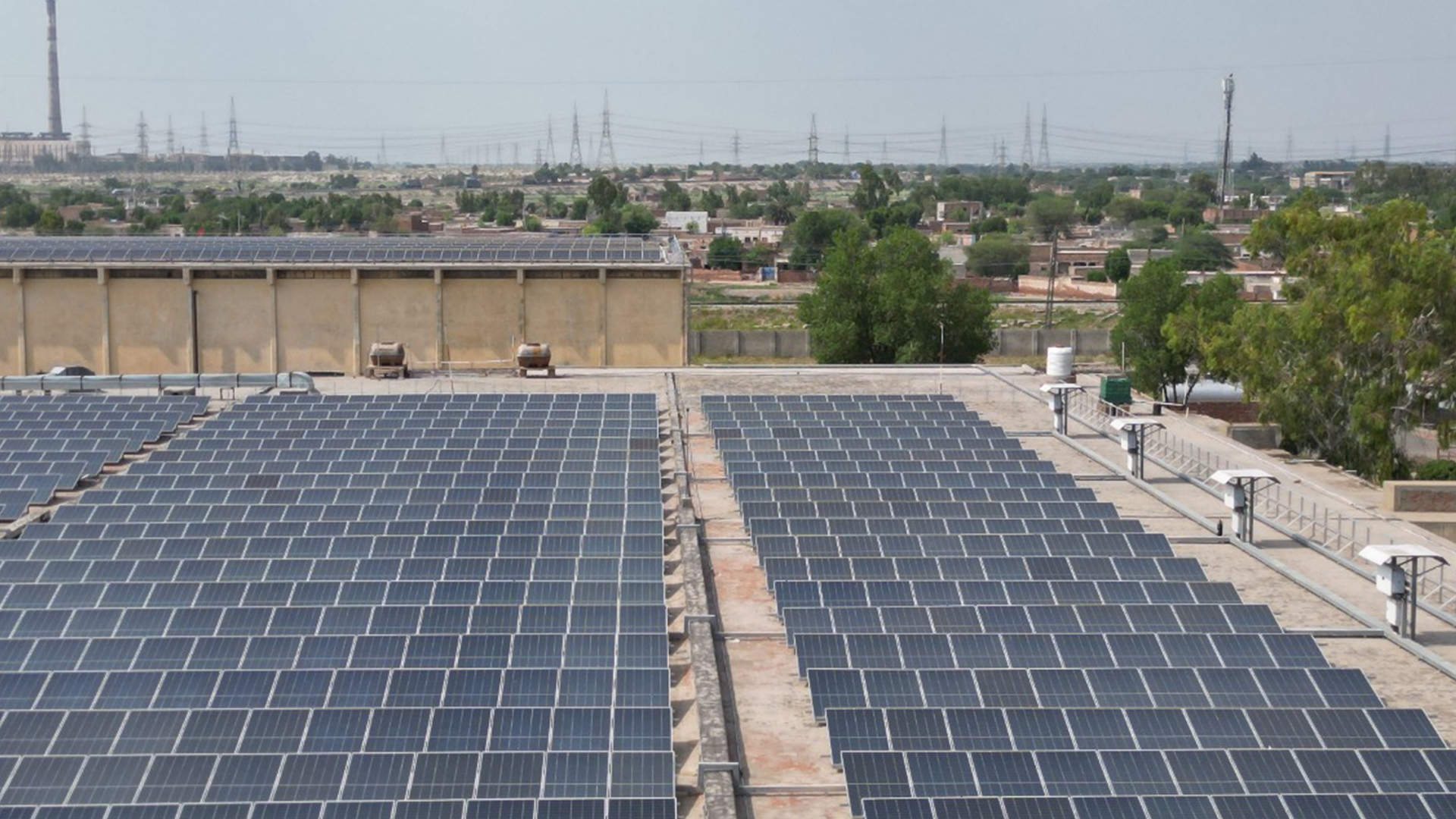 Solar panels on a sunny Pakistani rooftop